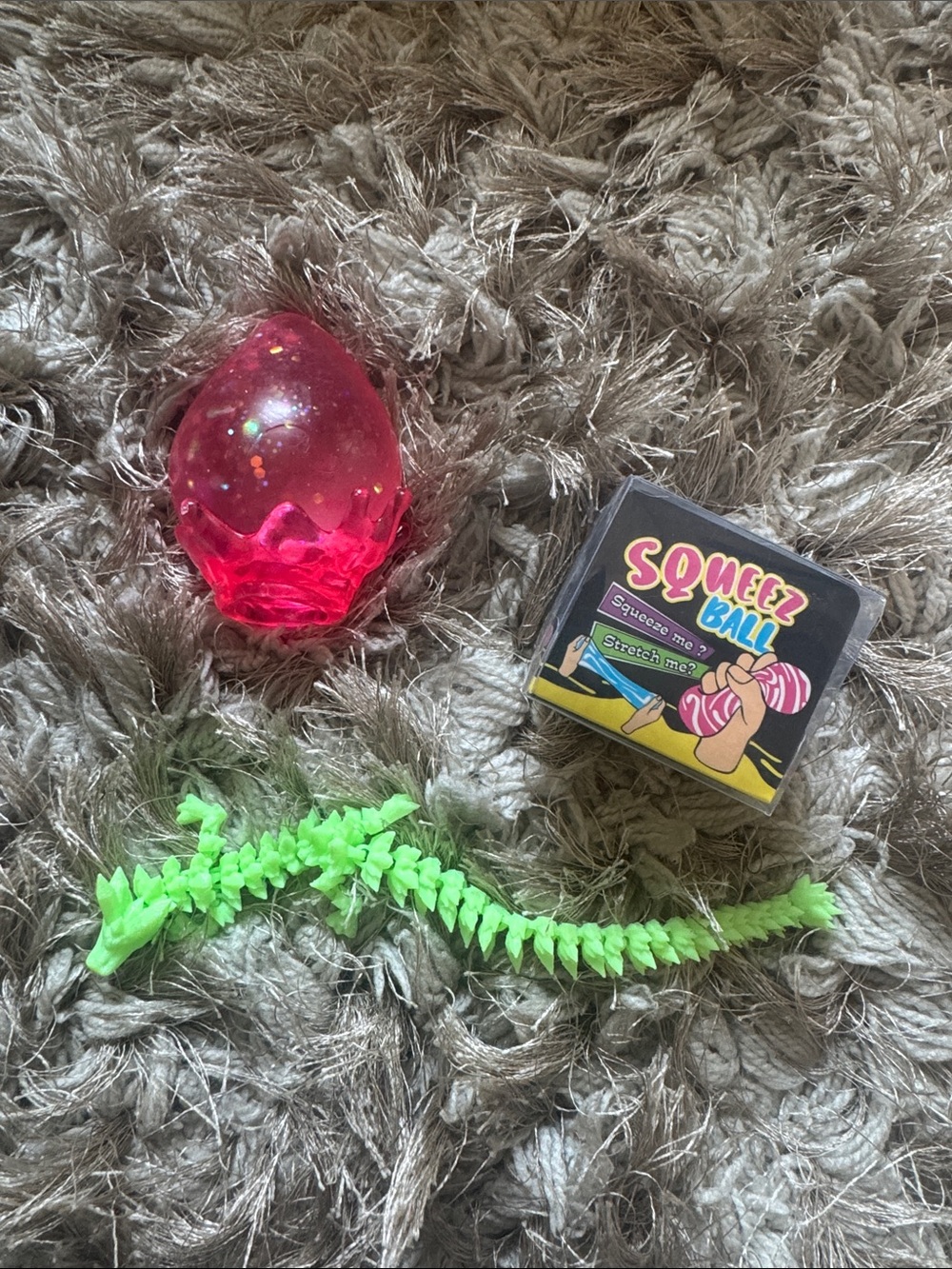 Squeez Ball Pink Glitter Egg & Neon Green Reptile Toy Set